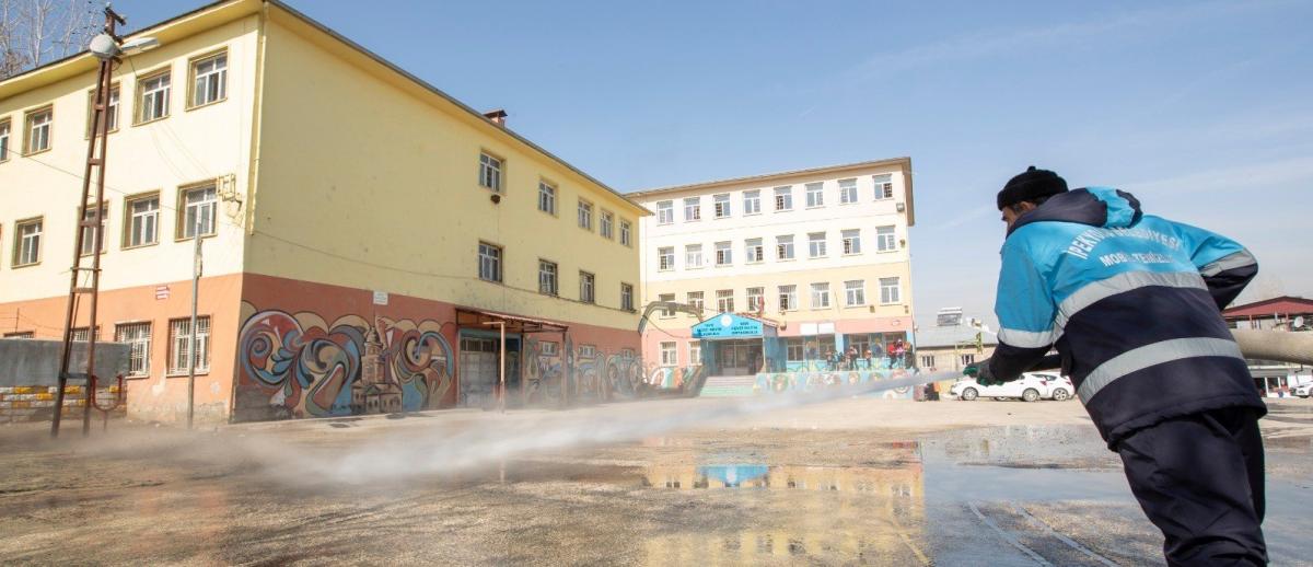 A worker disinfects a school in the Ipekyolu district of Turkey's eastern Van province