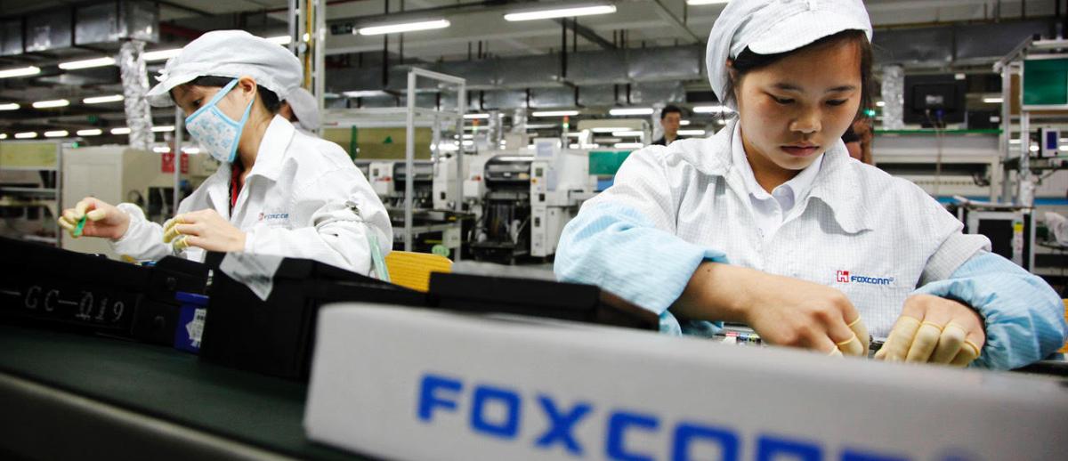 Factory workers on an assembly line