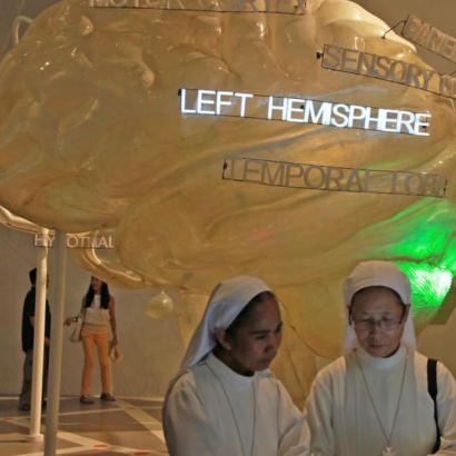 two nuns walk through an exhibit at the Brain Museum in Manila, Philippines