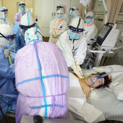 Medical staff care for a critically ill COVID-19 patient at a hospital in Wuhan, China