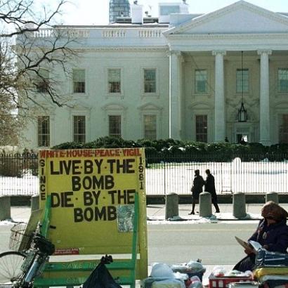 "live by the bomb - die by the bomb" - White House protest sign