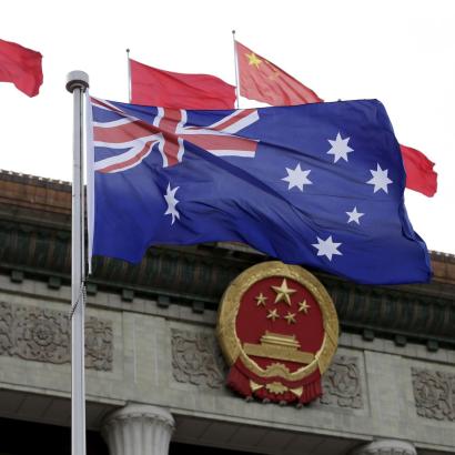 Australian flag waves in front of the Great Hall of the People in Beijing, China